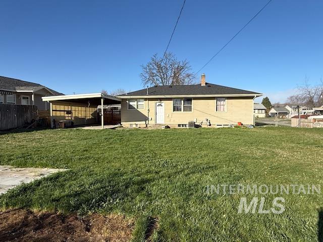 1139 Webster Street Clarkston, WA 99403 - Photo 24 of 34 Rear view of property featuring a fenced backyard, a chimney, and a patio area