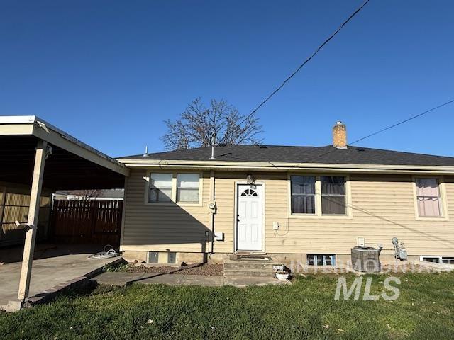 1139 Webster Street Clarkston, WA 99403 - Photo 25 of 34 Rear view of house with a chimney and entry steps