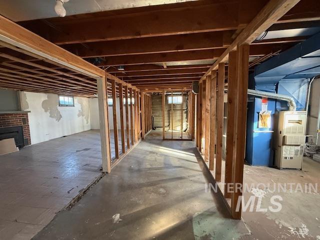 1139 Webster Street Clarkston, WA 99403 - Photo 33 of 34 Below grade area with heating unit and a brick fireplace