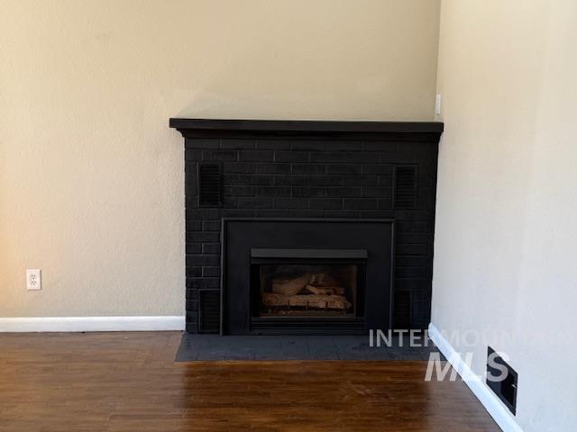1139 Webster Street Clarkston, WA 99403 - Photo 10 of 34 Detailed view of wood finished floors and a fireplace with flush hearth