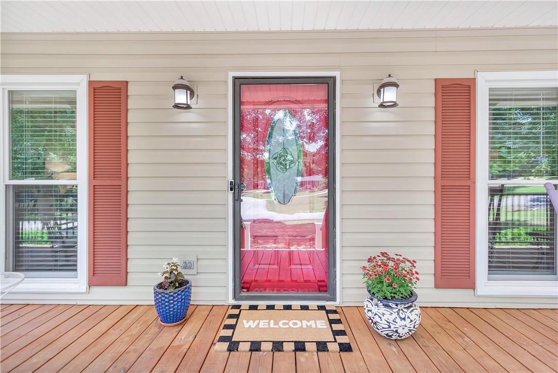 910 Chantilly Lane Anderson, SC 29625 - Photo 37 of 38 A cheerful entrance greets you with vibrant shutters and warm wooden flooring.