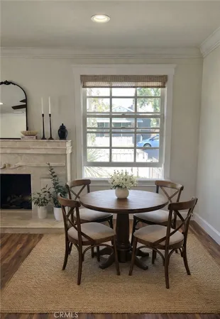 a view of a dining room with furniture and window