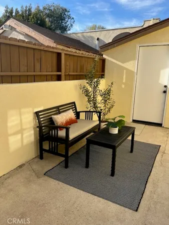 a view of a two chairs in the patio