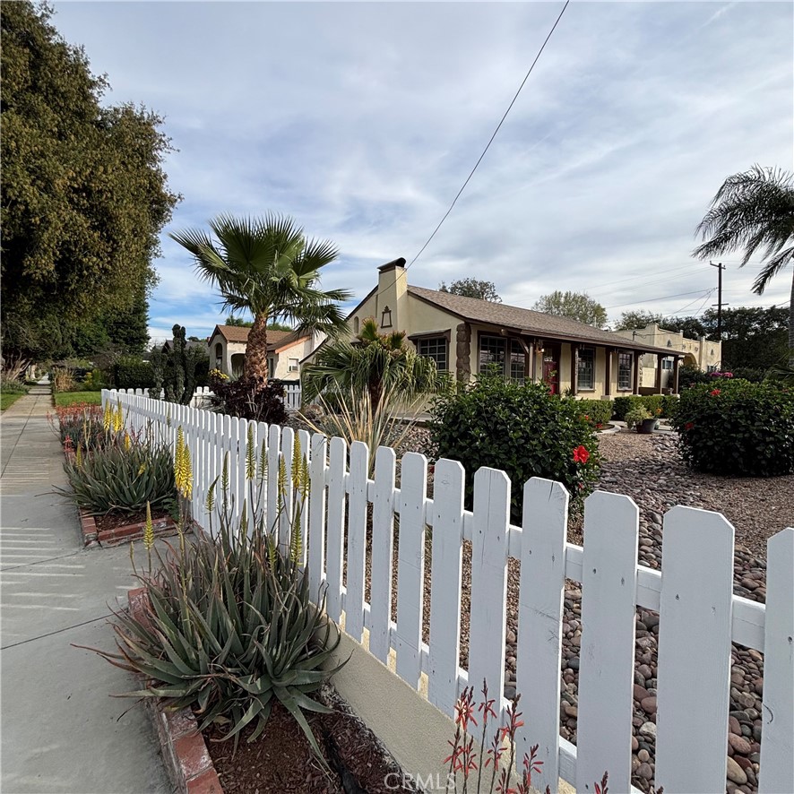 5012 Brockton Avenue Riverside, CA 92506 - Photo 5 of 28 a view of a house with wooden fence