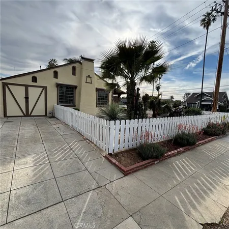 a view of a wrought iron fences in front of house
