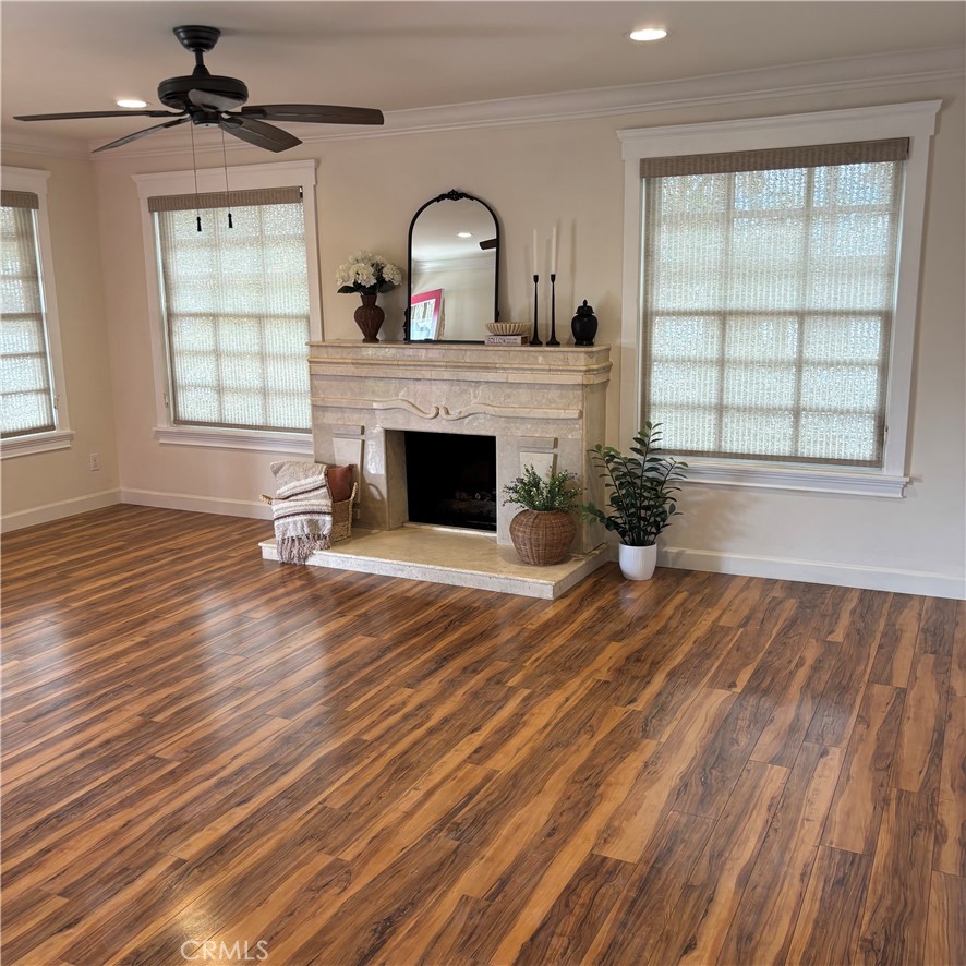 5012 Brockton Avenue Riverside, CA 92506 - Photo 8 of 28 wooden floor fireplace and windows in an empty room