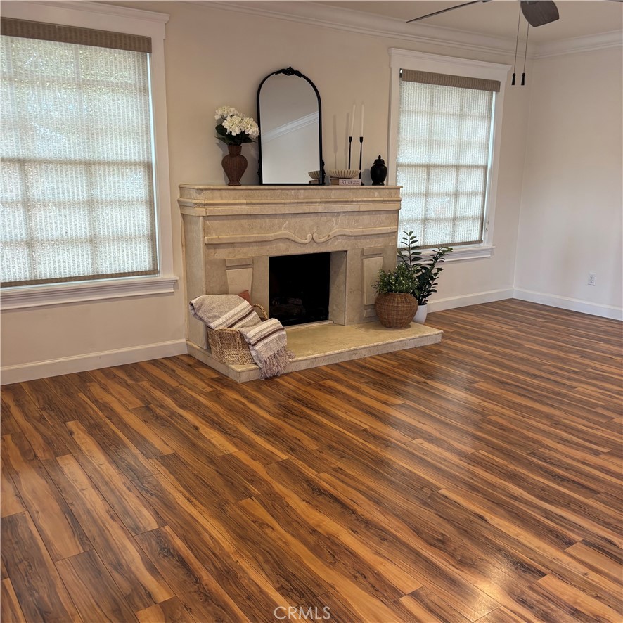 5012 Brockton Avenue Riverside, CA 92506 - Photo 10 of 28 a view of a livingroom with wooden floor and a fireplace
