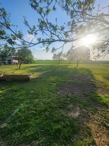 a view of a golf course with a lake