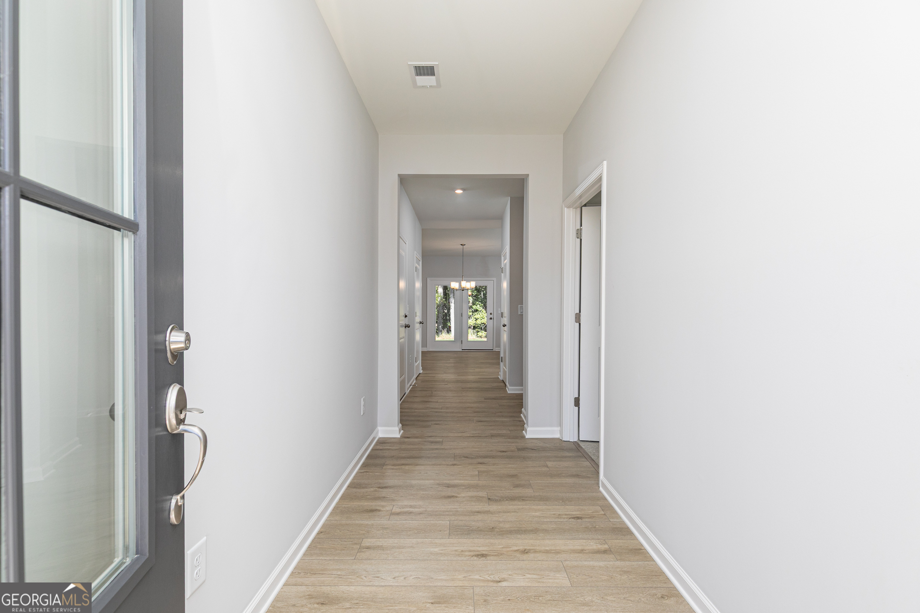732 Coventry Cv Way Acworth, GA 30102 - Photo 3 of 41 a view of a hallway with wooden floor