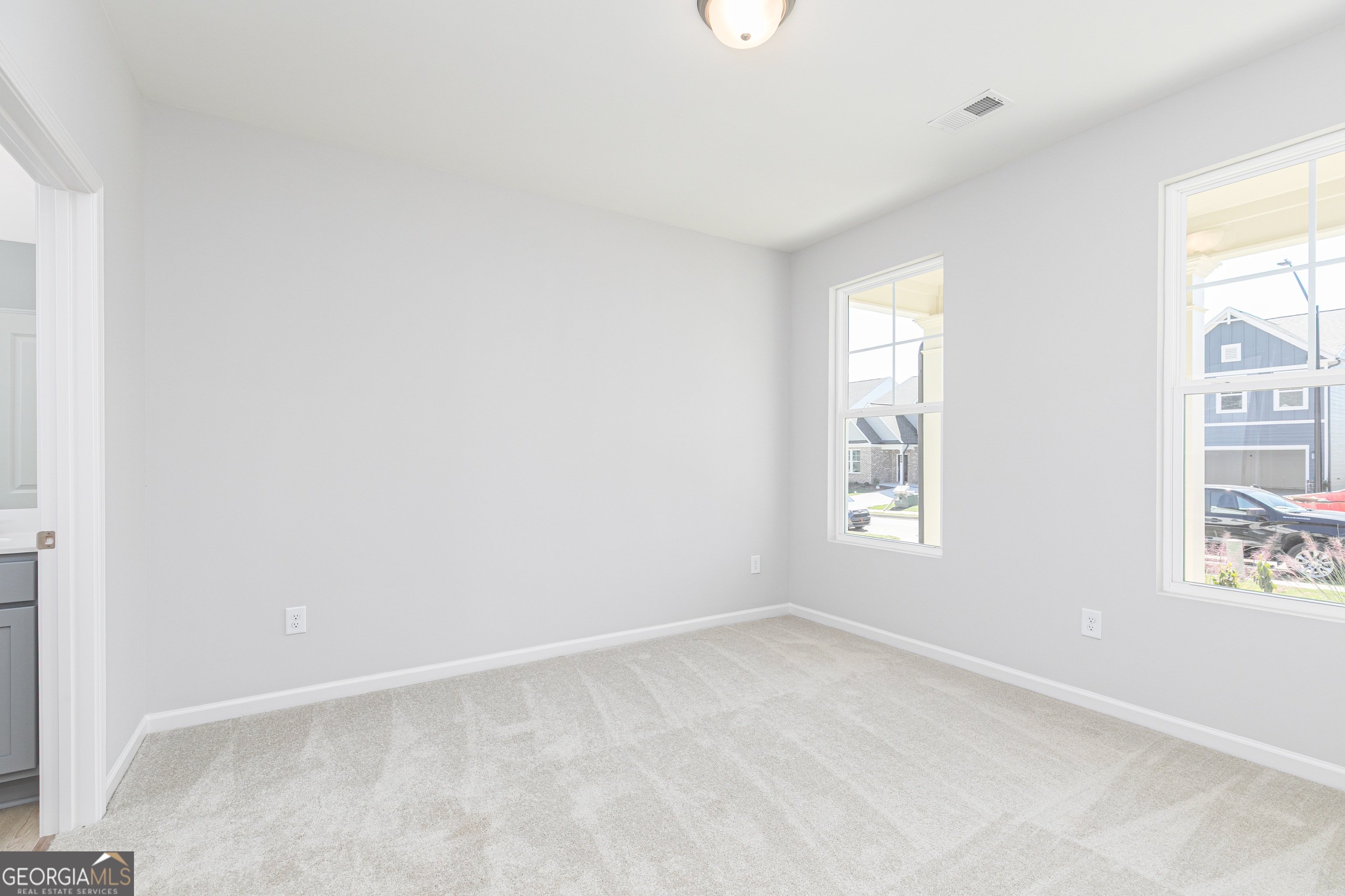 732 Coventry Cv Way Acworth, GA 30102 - Photo 5 of 41 an empty room with windows