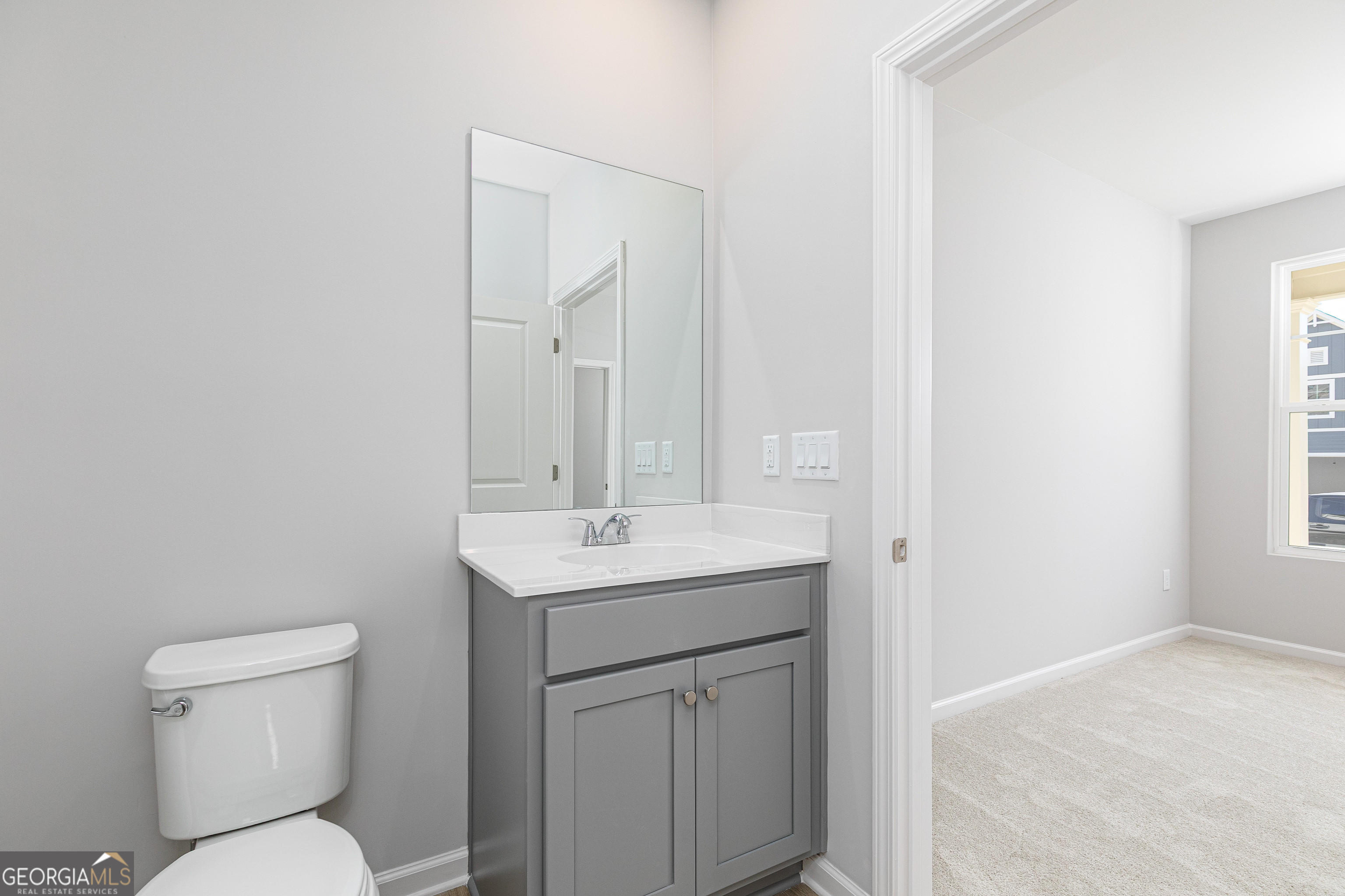 732 Coventry Cv Way Acworth, GA 30102 - Photo 9 of 41 a bathroom with a toilet a sink and mirror