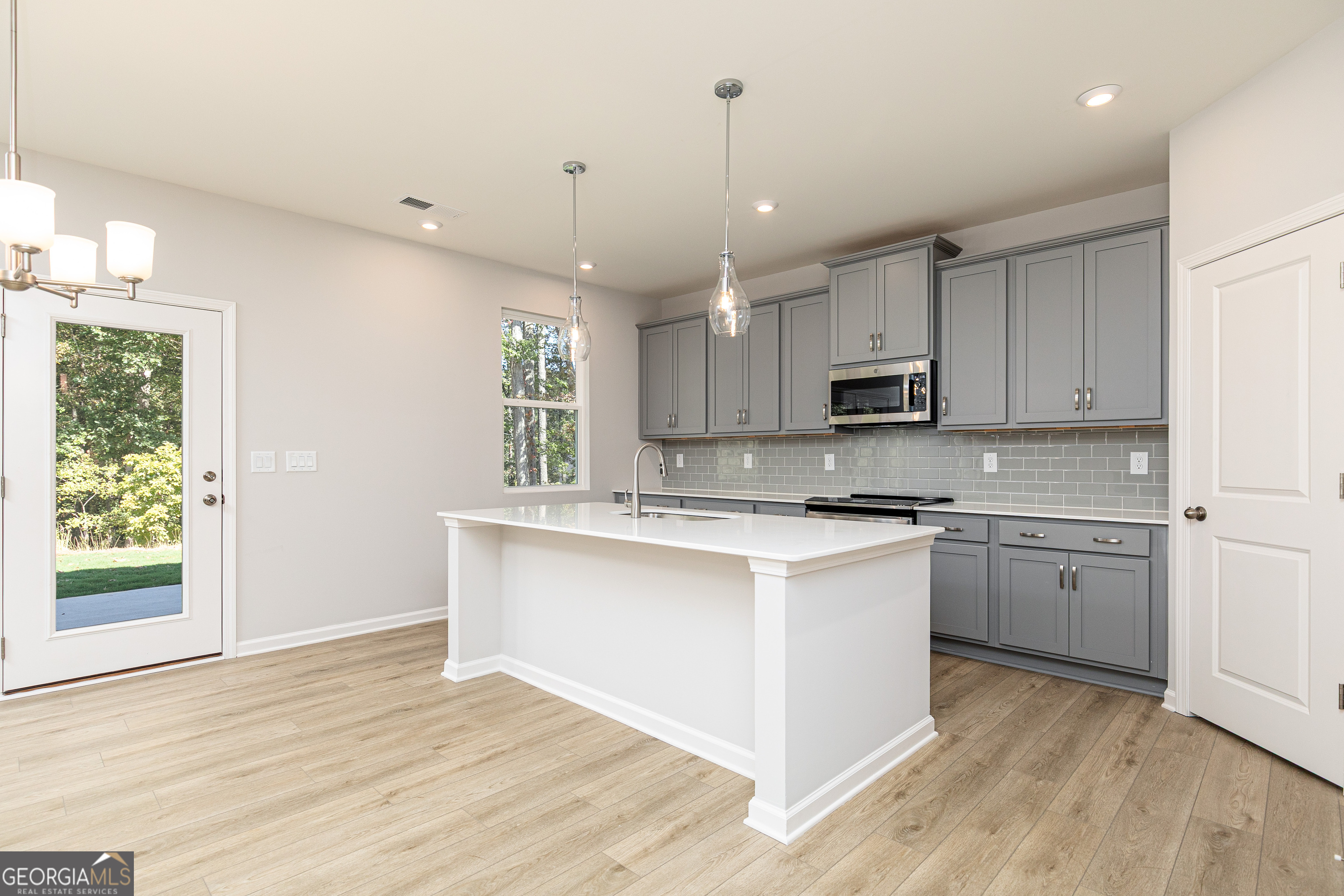 732 Coventry Cv Way Acworth, GA 30102 - Photo 10 of 41 a kitchen with a stove a sink and a refrigerator