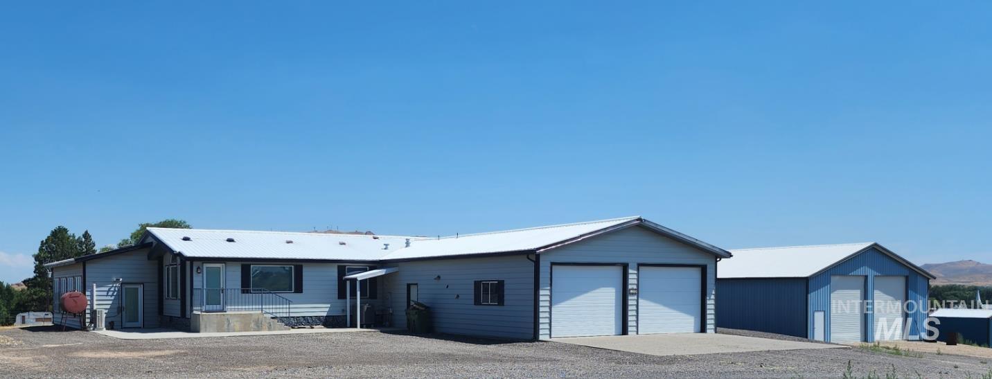 View of front of property with a detached garage