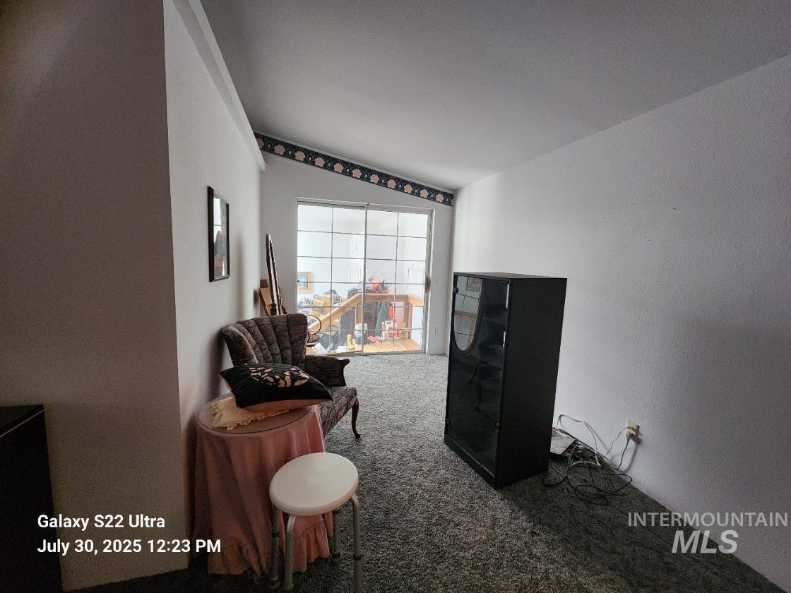 650 Ash Street Vale, OR 97918 - Photo 20 of 24 Sitting room with carpet flooring and lofted ceiling