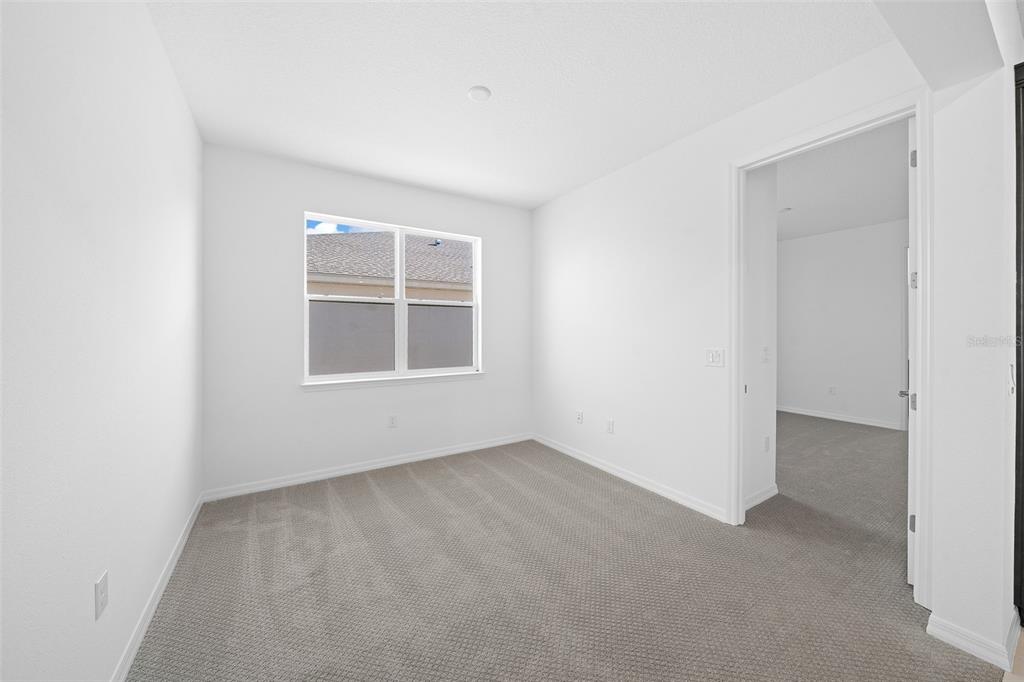 6303 Southwest 75th Ct Road Ocala, FL 34474 - Photo 17 of 50 an empty room with windows