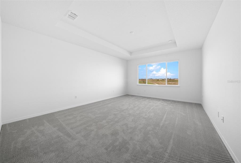 6303 Southwest 75th Ct Road Ocala, FL 34474 - Photo 20 of 50 an empty room with windows