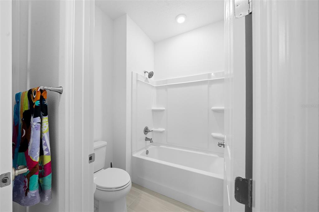 6303 Southwest 75th Ct Road Ocala, FL 34474 - Photo 37 of 50 a bathroom with a bathtub and a toilet