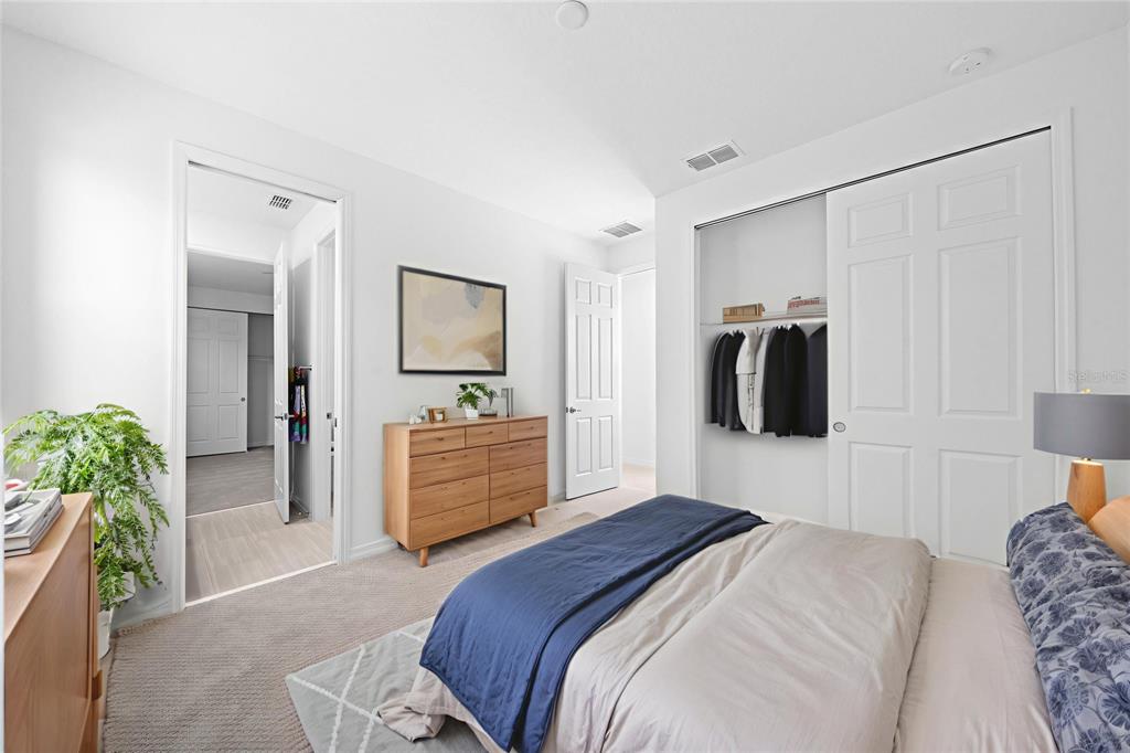 6303 Southwest 75th Ct Road Ocala, FL 34474 - Photo 38 of 50 a bedroom with a bed and a couch