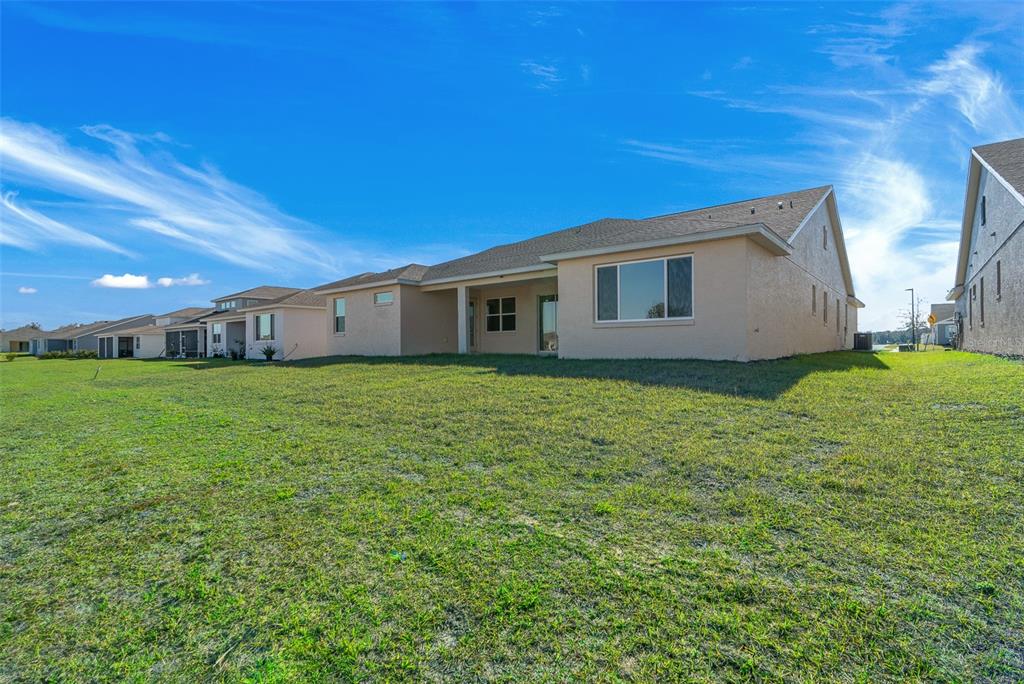 6303 Southwest 75th Ct Road Ocala, FL 34474 - Photo 49 of 50 a house view with a garden space