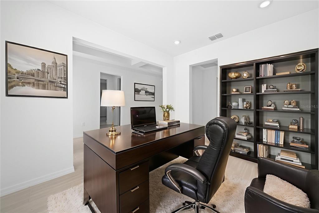 6303 Southwest 75th Ct Road Ocala, FL 34474 - Photo 5 of 50 a view of a workspace with furniture