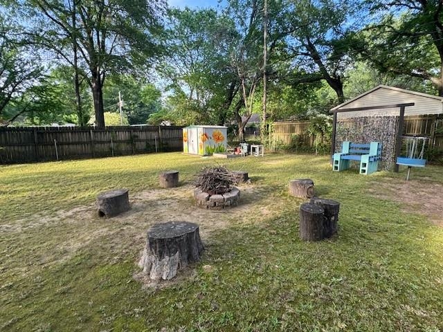 1244 Dearing Road Memphis, TN 38117 - Photo 23 of 23 a view of a swimming pool with lawn chairs and a fire pit