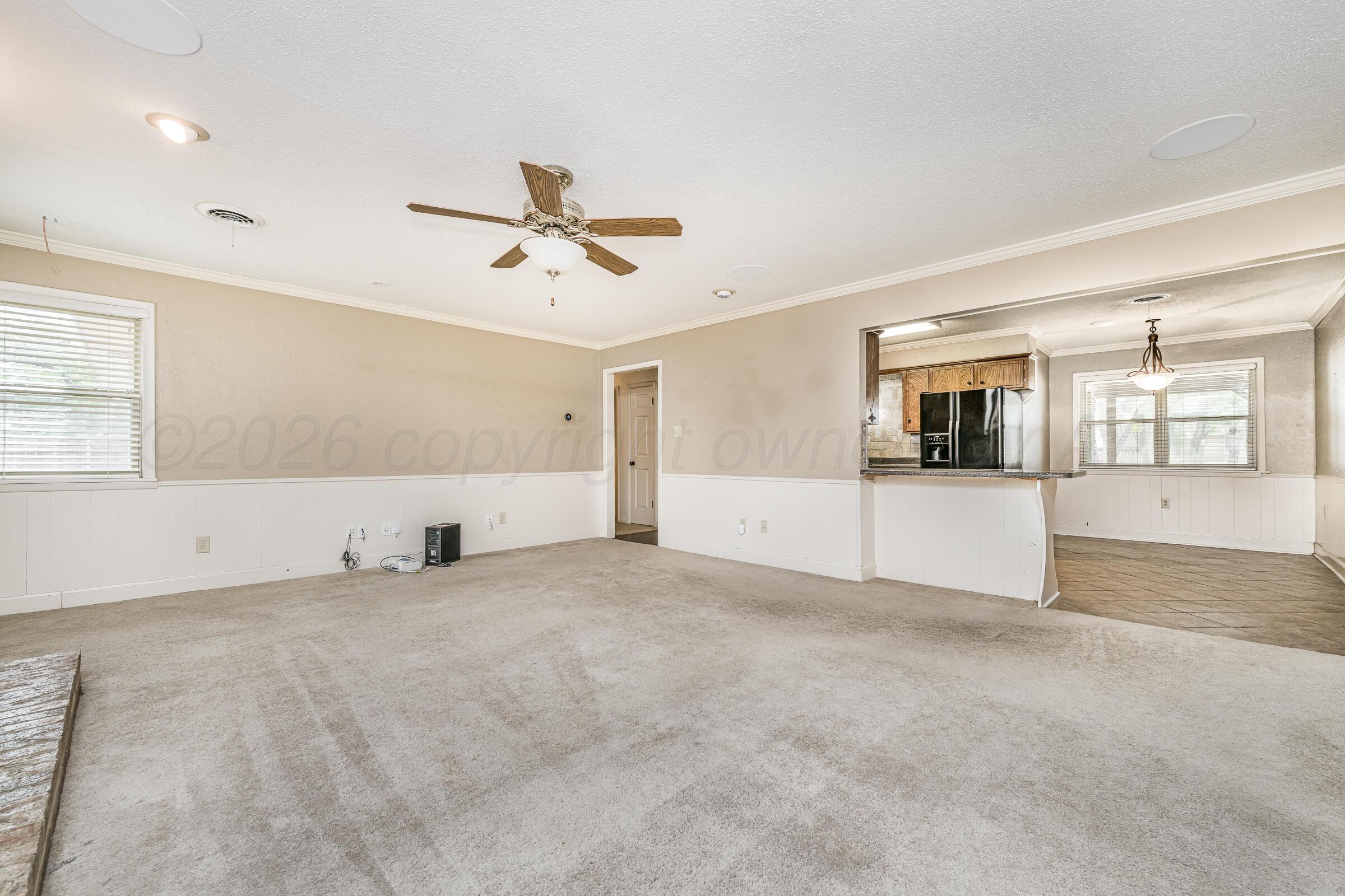 4400 West Farmers Avenue Amarillo, TX 79110 - Photo 8 of 27 a view of an empty room with a window