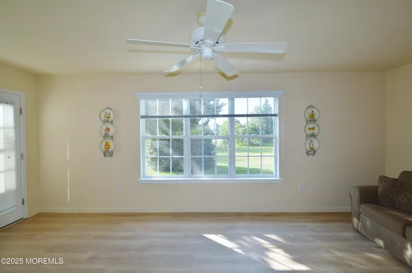 a view of an empty room with a window