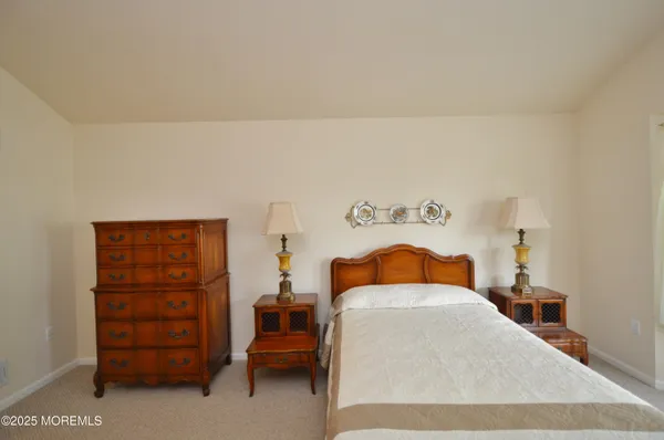 a bedroom with a bed and closet