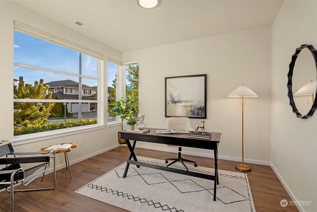a view of a workspace with furniture