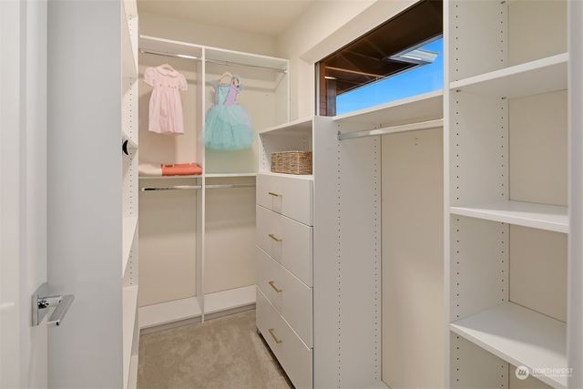 a bathroom with a shower and a sink