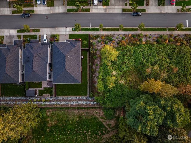 a view of swimming pool with outdoor seating and plants