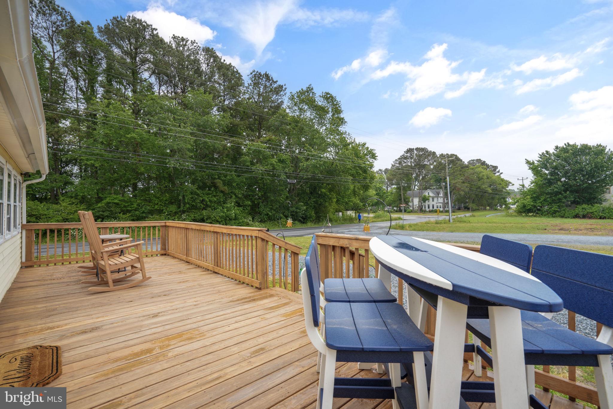 7278 Fleming Road New Church, VA 23415 - Photo 29 of 44 a view of house with a table and chair