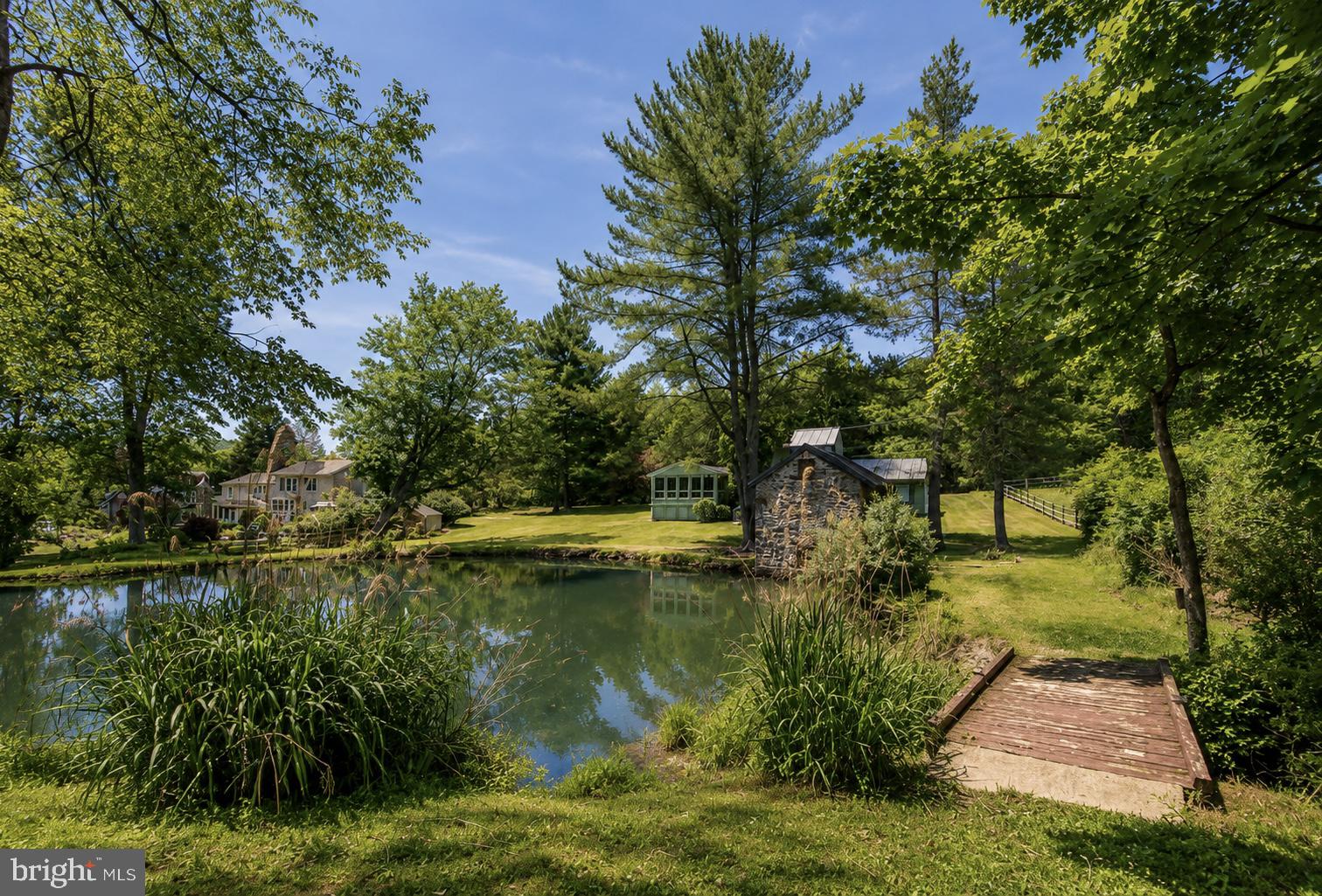108 Sheeder Road Phoenixville, PA 19460 - Photo 36 of 42 a view of a lake with a building in the background