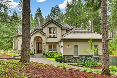 a front view of a house with garden