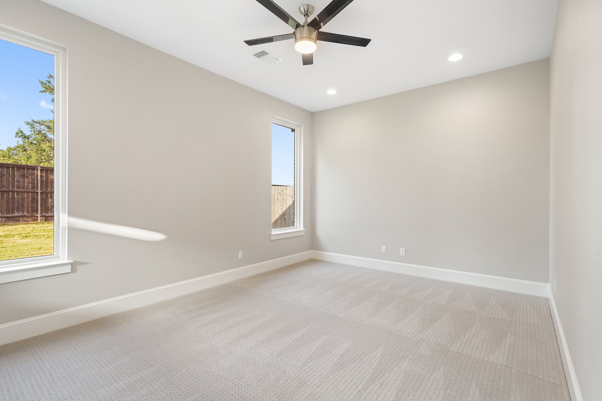 112 Axis Loop Georgetown, TX 78628 - Photo 19 of 39 an empty room with windows and fan