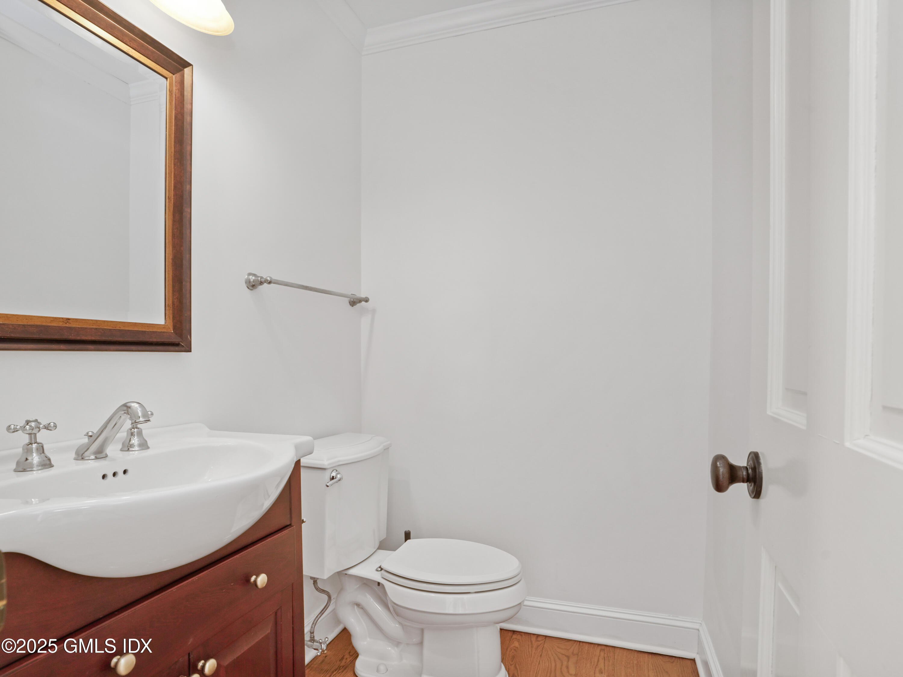 77 Sheep Hill Road Riverside, CT 06878 - Photo 11 of 34 a bathroom with a sink a toilet and a mirror
