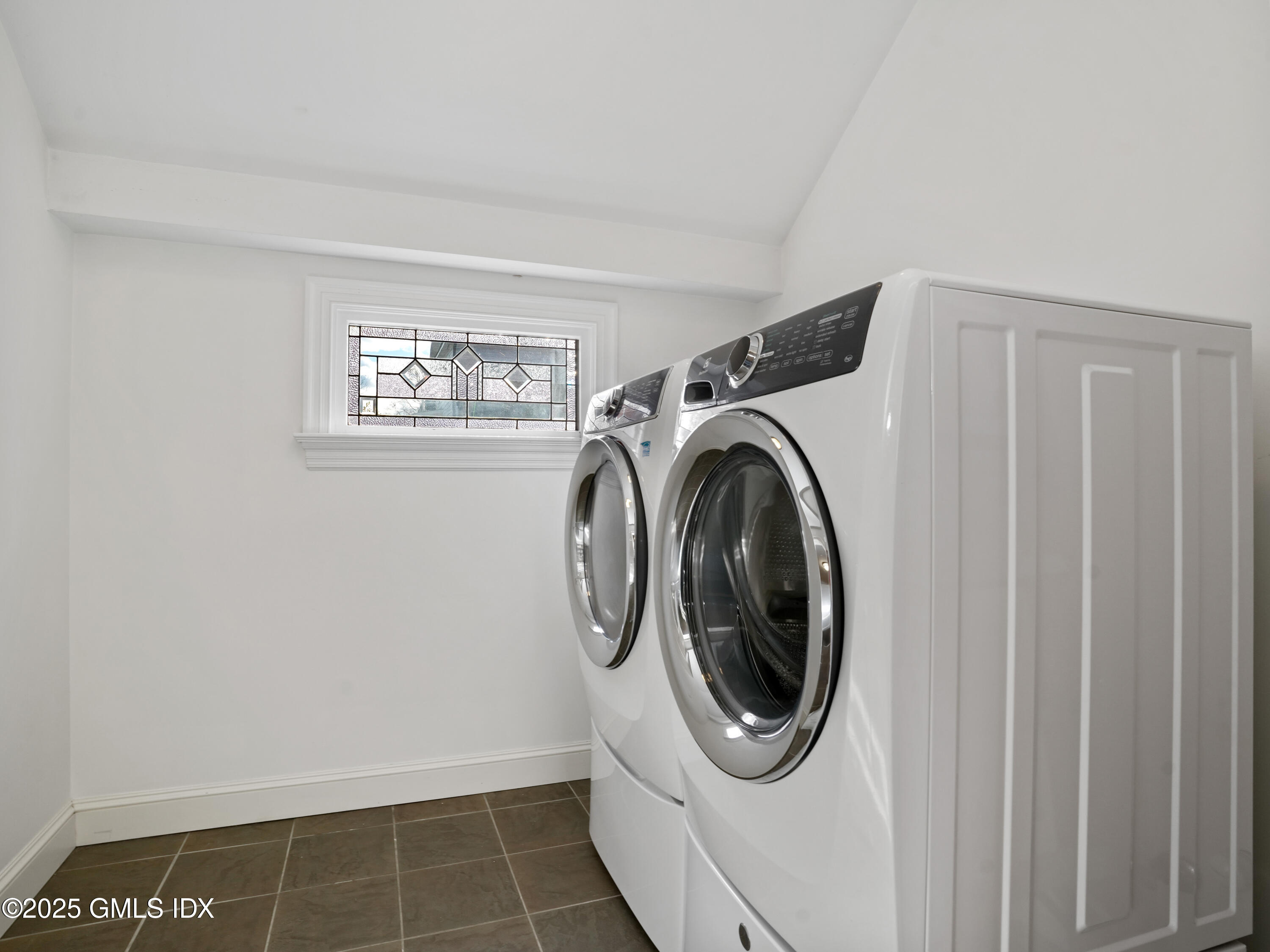 77 Sheep Hill Road Riverside, CT 06878 - Photo 12 of 34 a utility room with dryer and washer