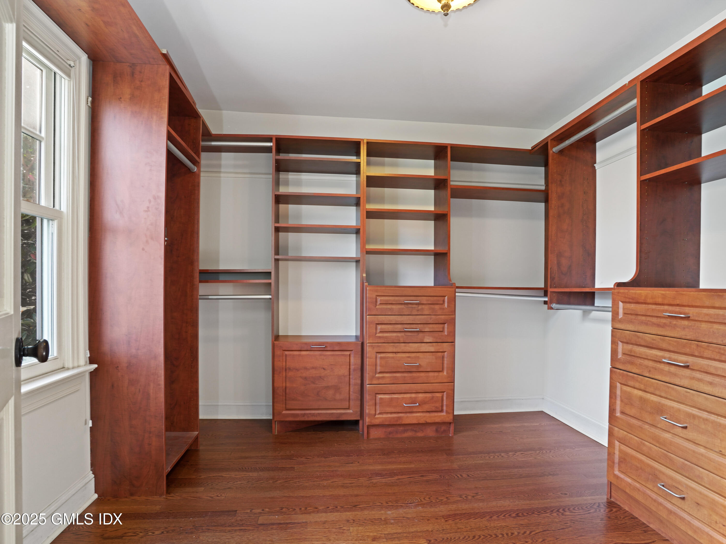 77 Sheep Hill Road Riverside, CT 06878 - Photo 14 of 34 a view of walk in closet with empty racks