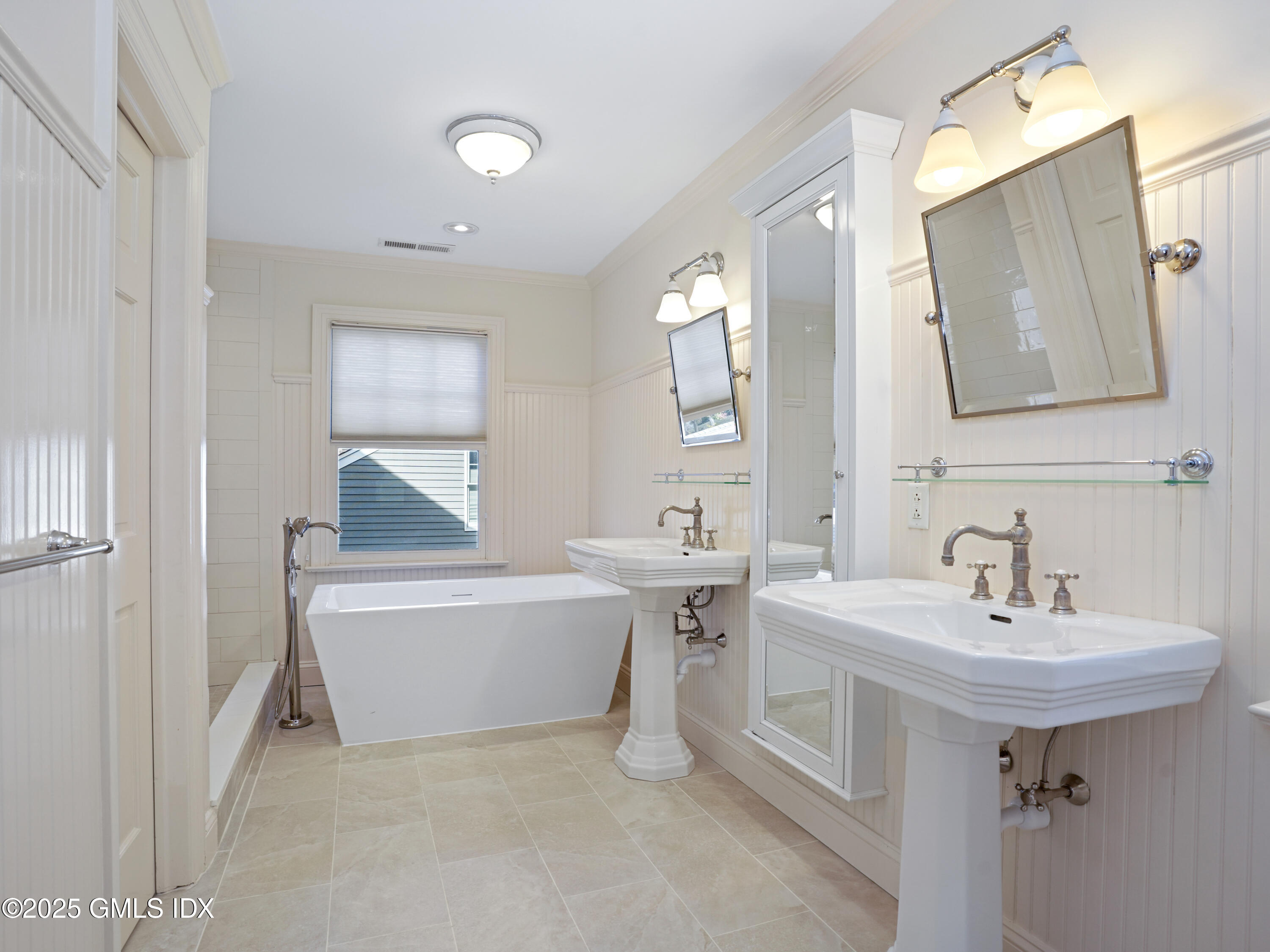 77 Sheep Hill Road Riverside, CT 06878 - Photo 15 of 34 a bathroom with a sink and a mirror