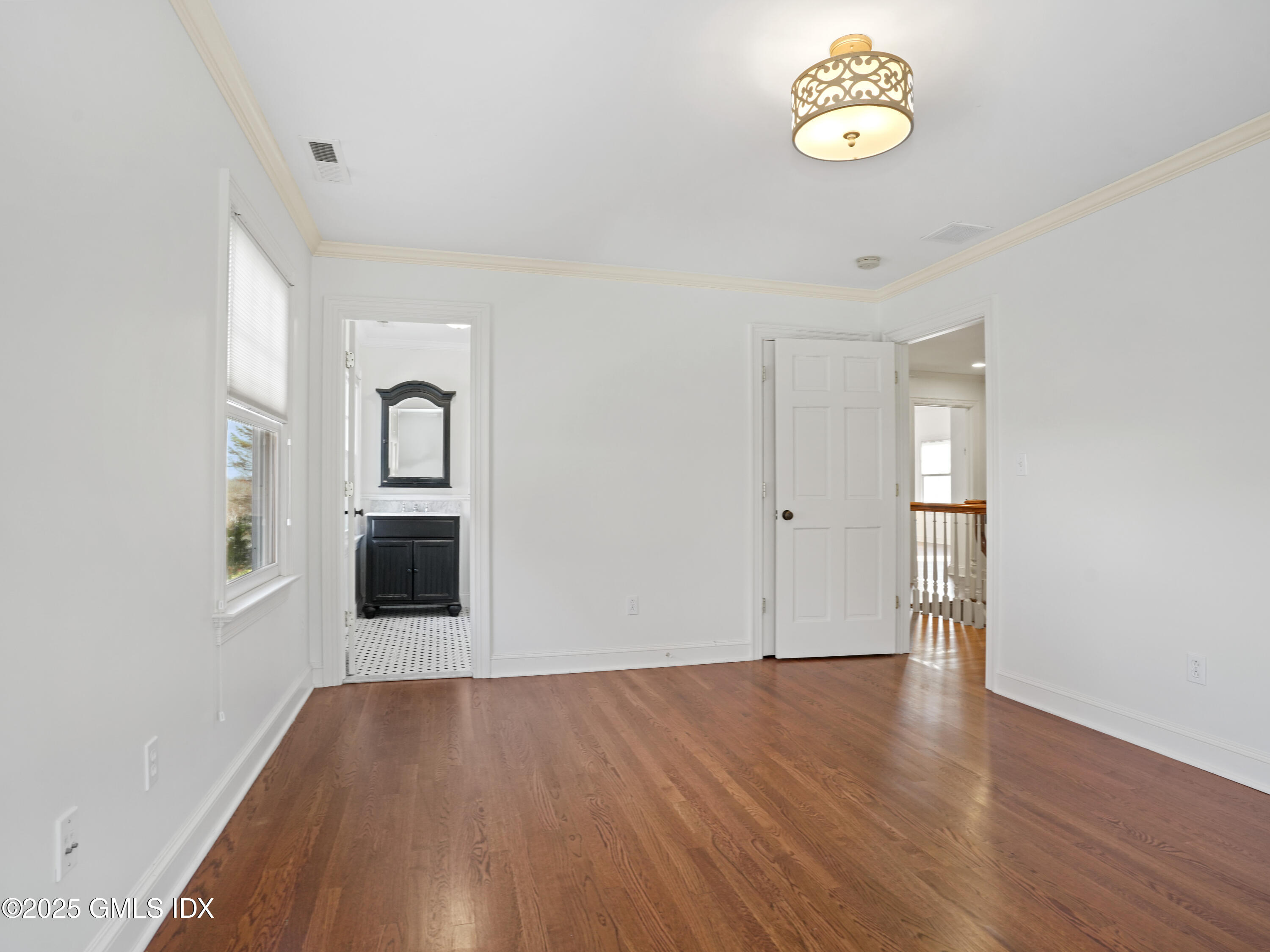 77 Sheep Hill Road Riverside, CT 06878 - Photo 17 of 34 an empty room with wooden floor and windows