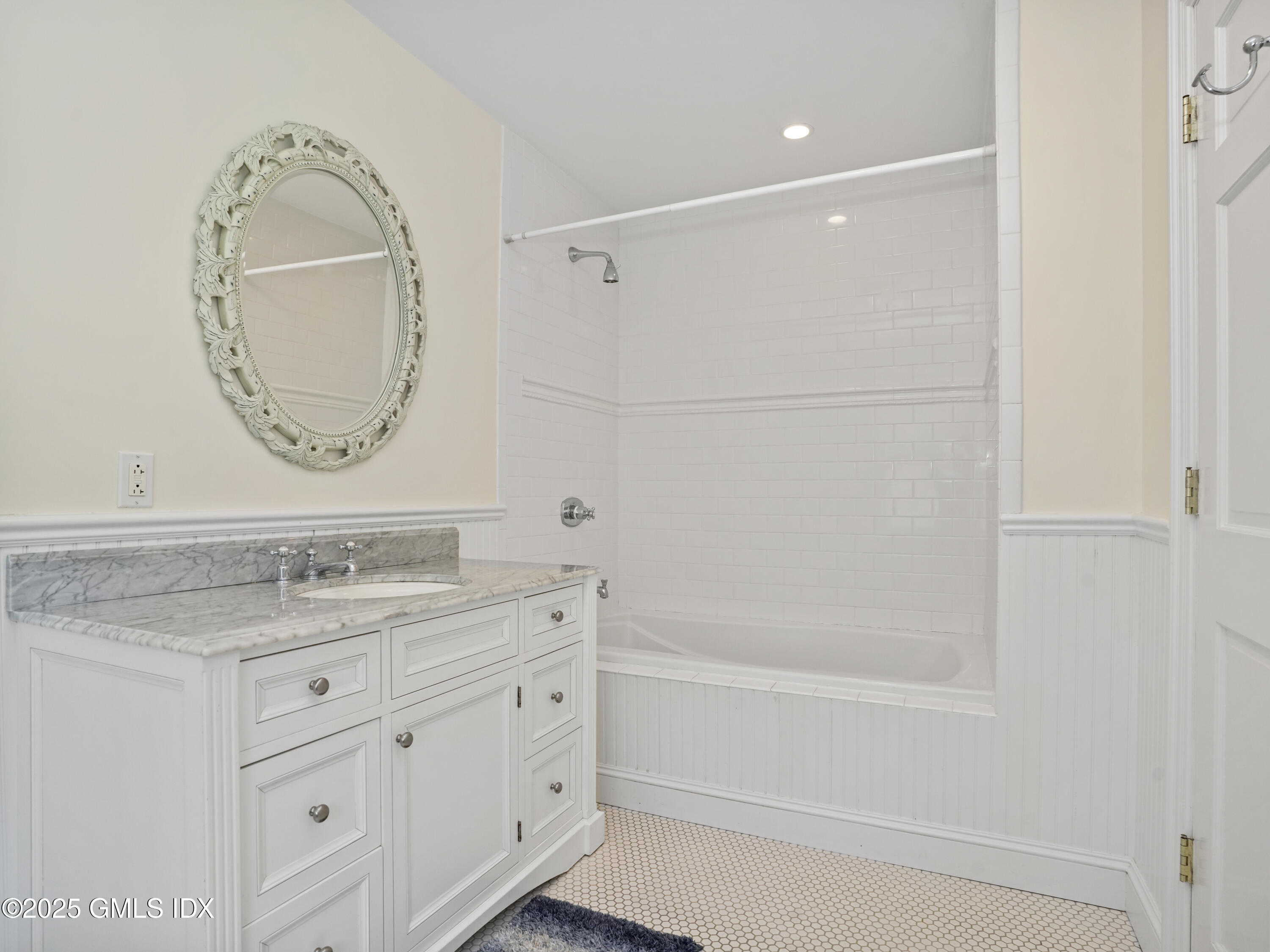 77 Sheep Hill Road Riverside, CT 06878 - Photo 20 of 34 a bathroom with a granite countertop sink a mirror and a shower