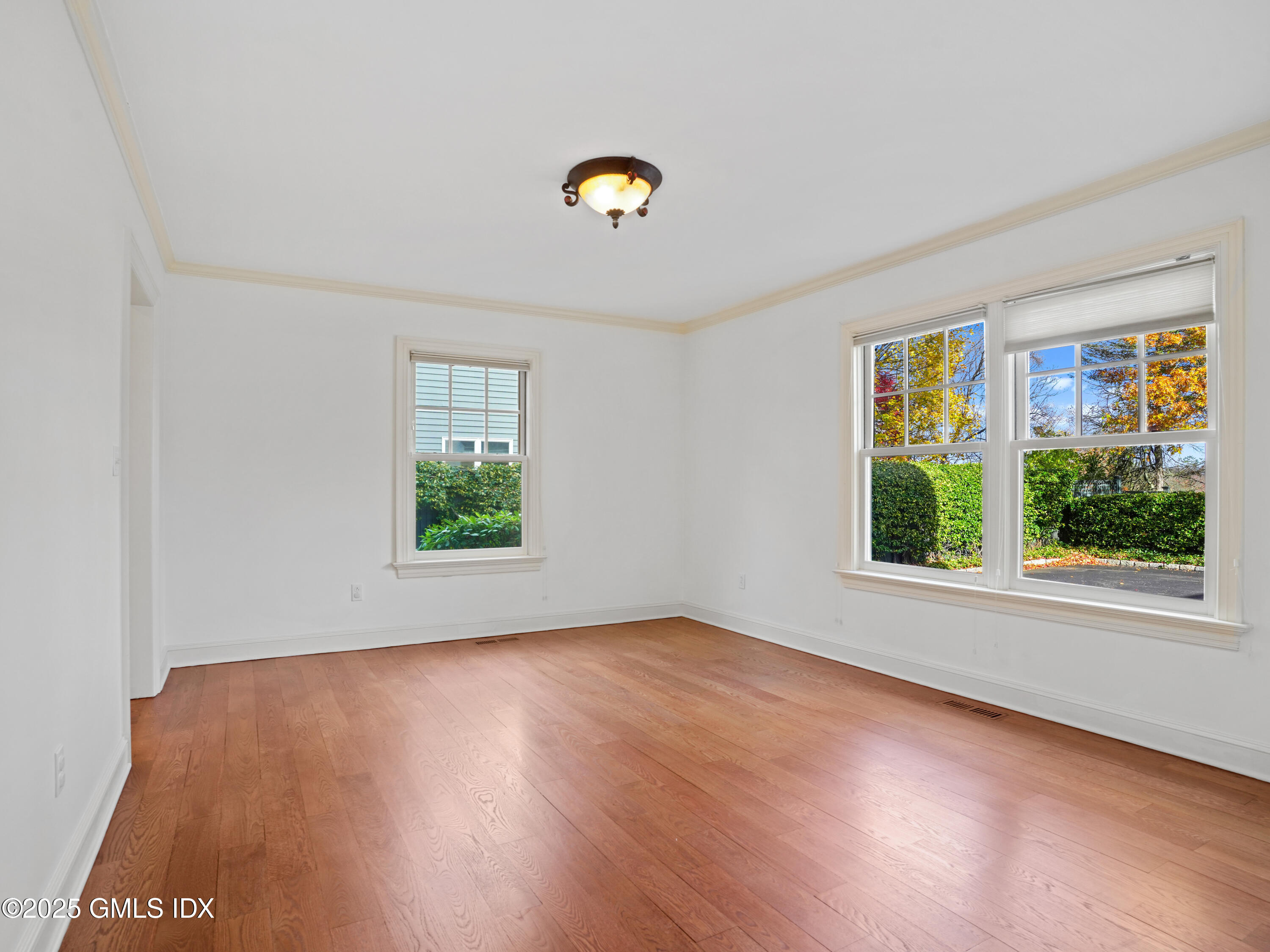 77 Sheep Hill Road Riverside, CT 06878 - Photo 24 of 34 a view of a livingroom with wooden floor and a window
