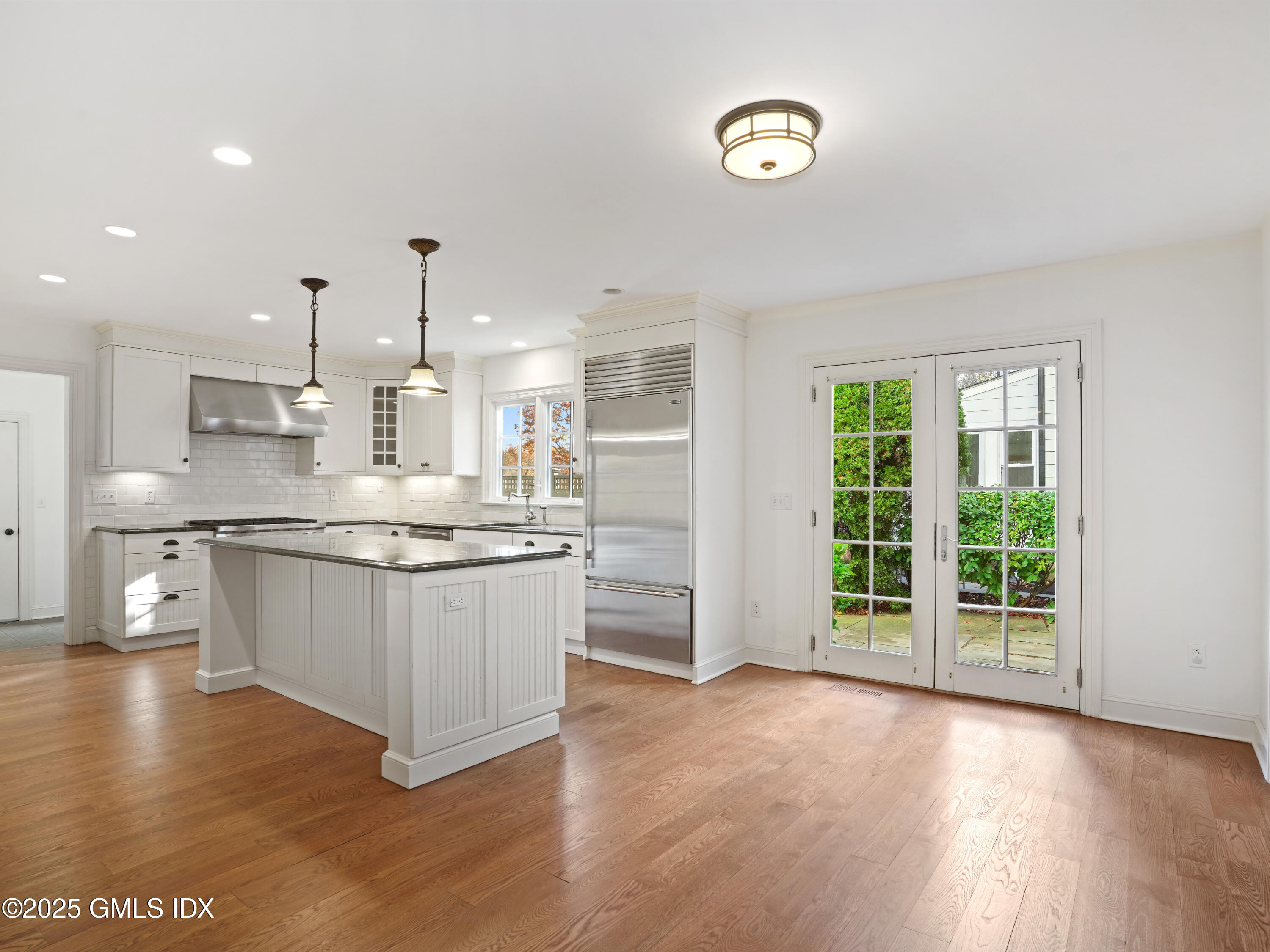77 Sheep Hill Road Riverside, CT 06878 - Photo 28 of 34 a kitchen with granite countertop a stove a sink and a refrigerator