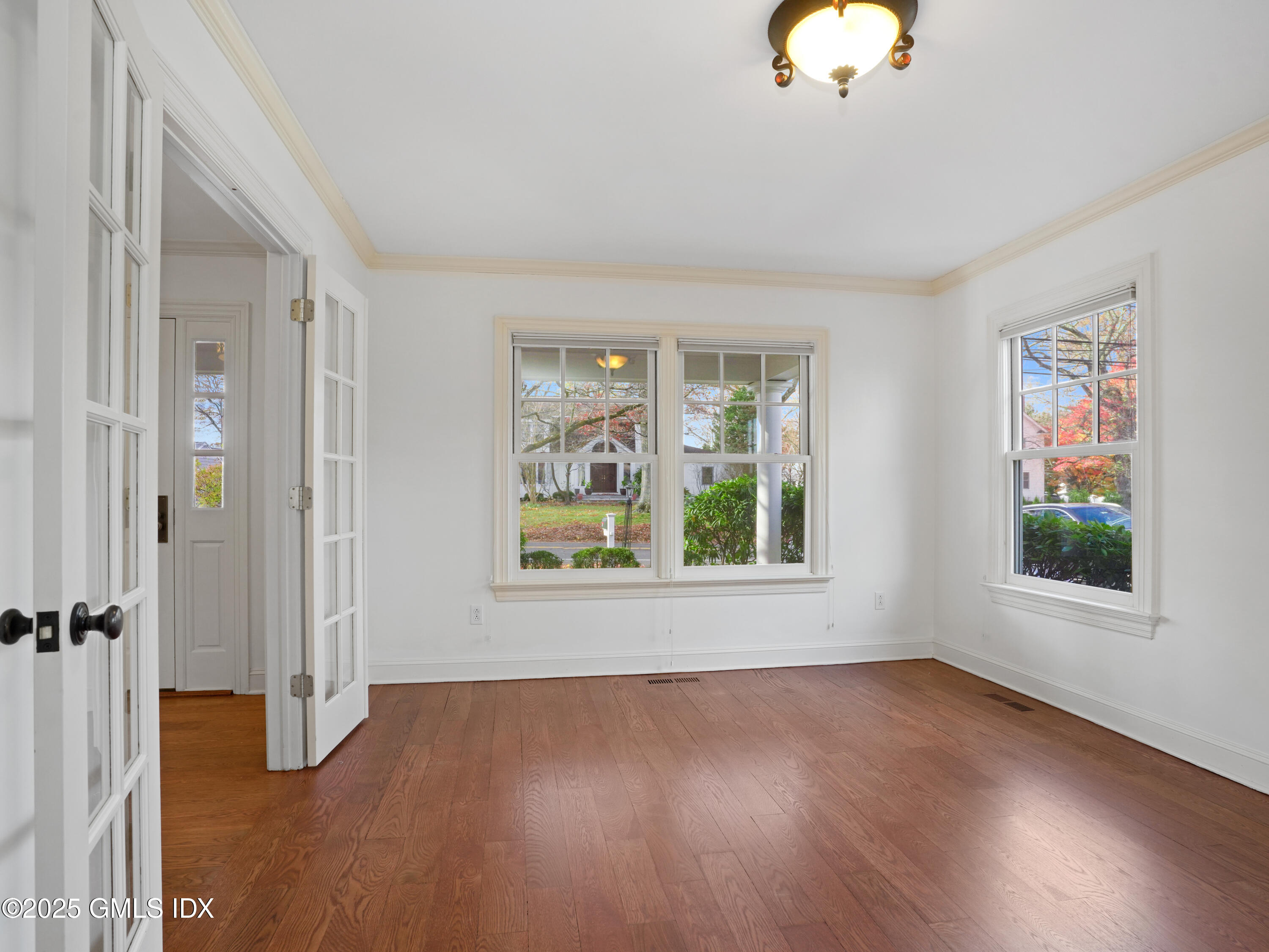 77 Sheep Hill Road Riverside, CT 06878 - Photo 29 of 34 wooden floor in an empty room with a window