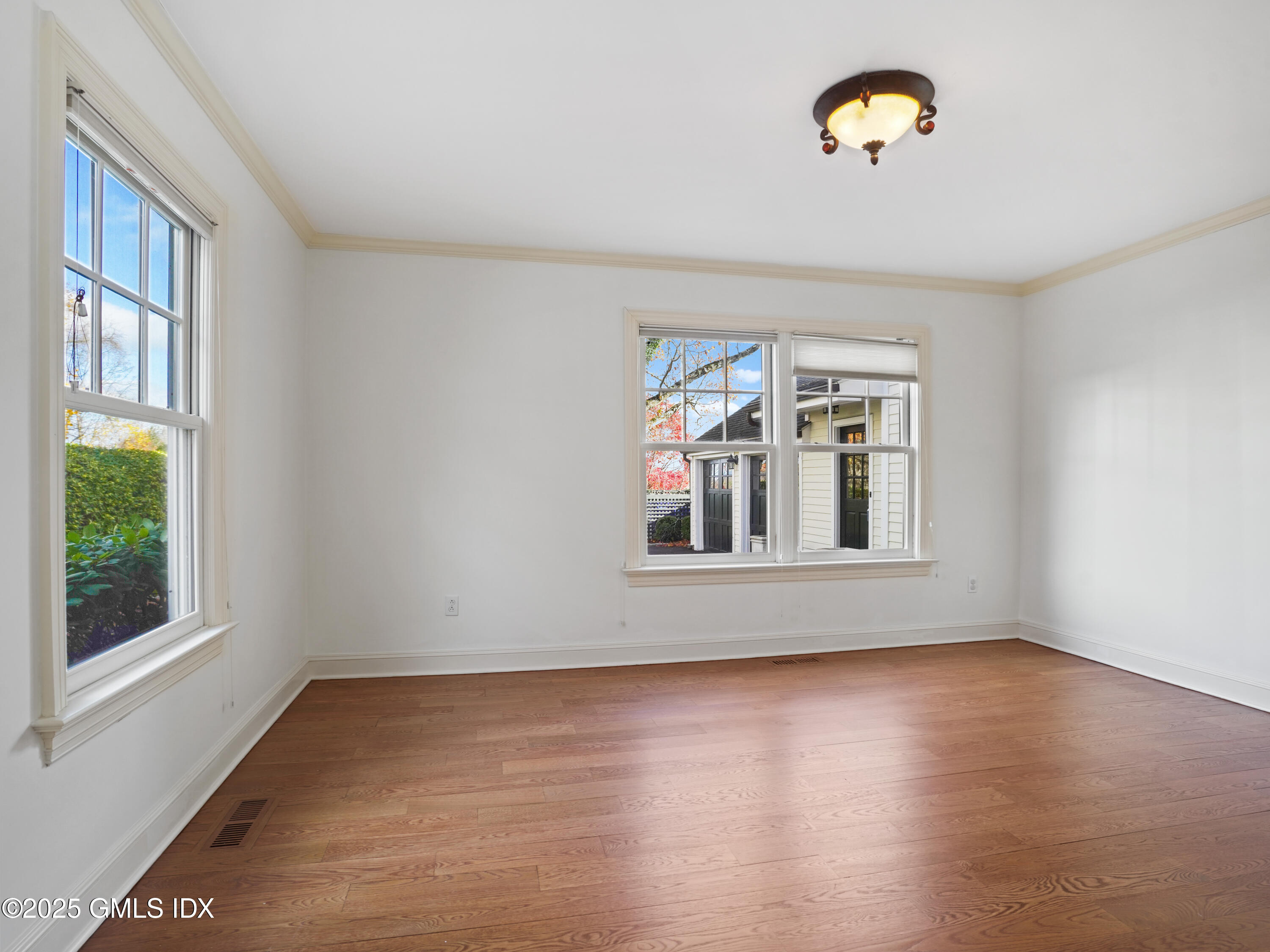 77 Sheep Hill Road Riverside, CT 06878 - Photo 31 of 34 a view of a livingroom with wooden floor and a window