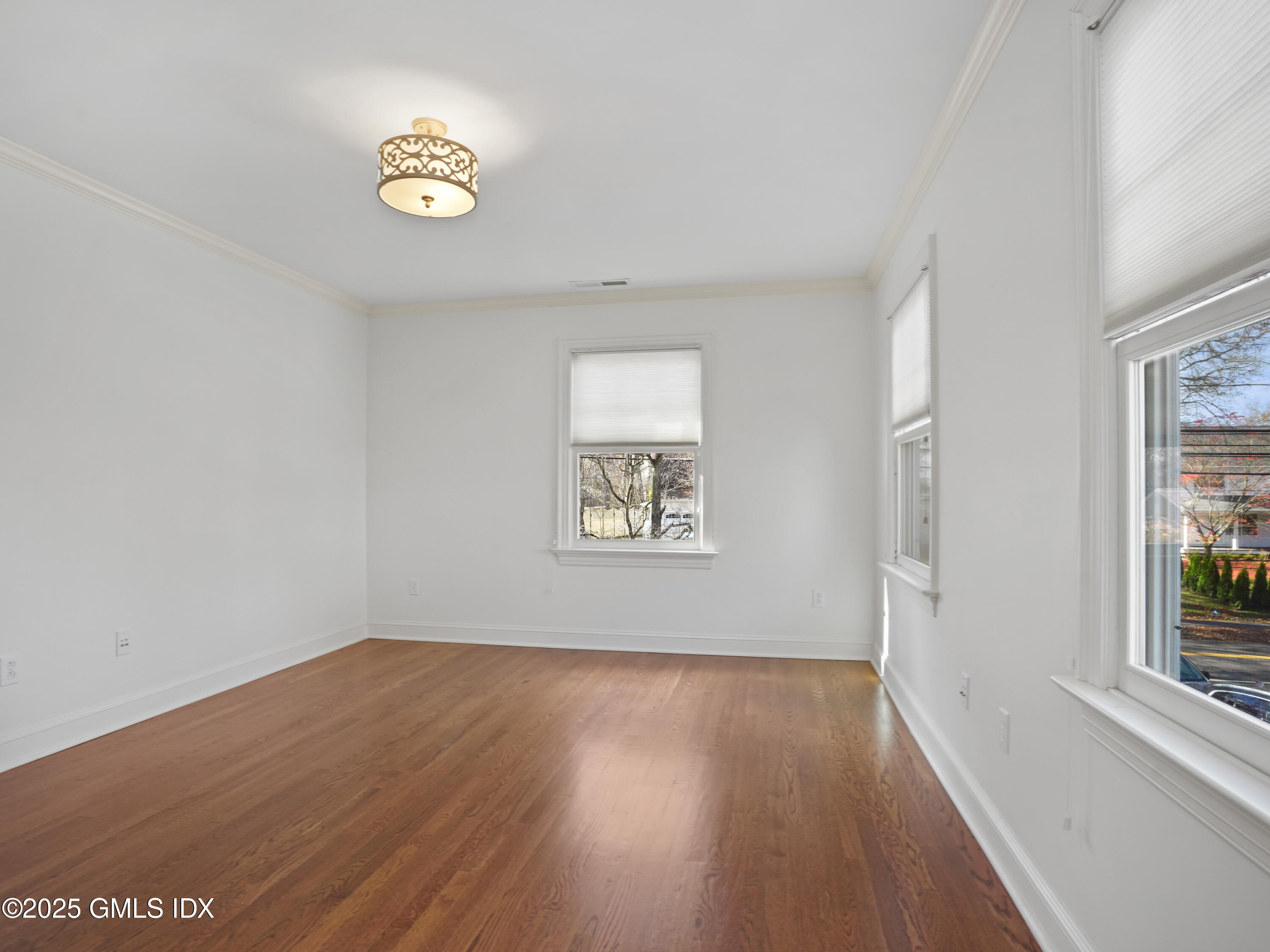 77 Sheep Hill Road Riverside, CT 06878 - Photo 34 of 34 a view of an empty room with wooden floor and a window