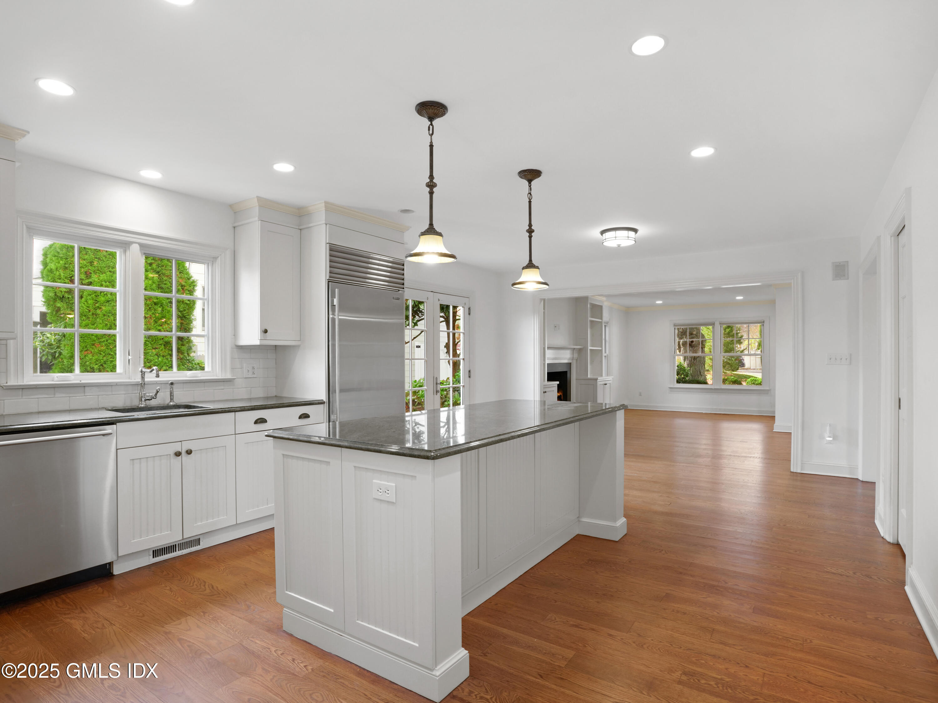 77 Sheep Hill Road Riverside, CT 06878 - Photo 8 of 34 a kitchen with stainless steel appliances granite countertop a sink and window