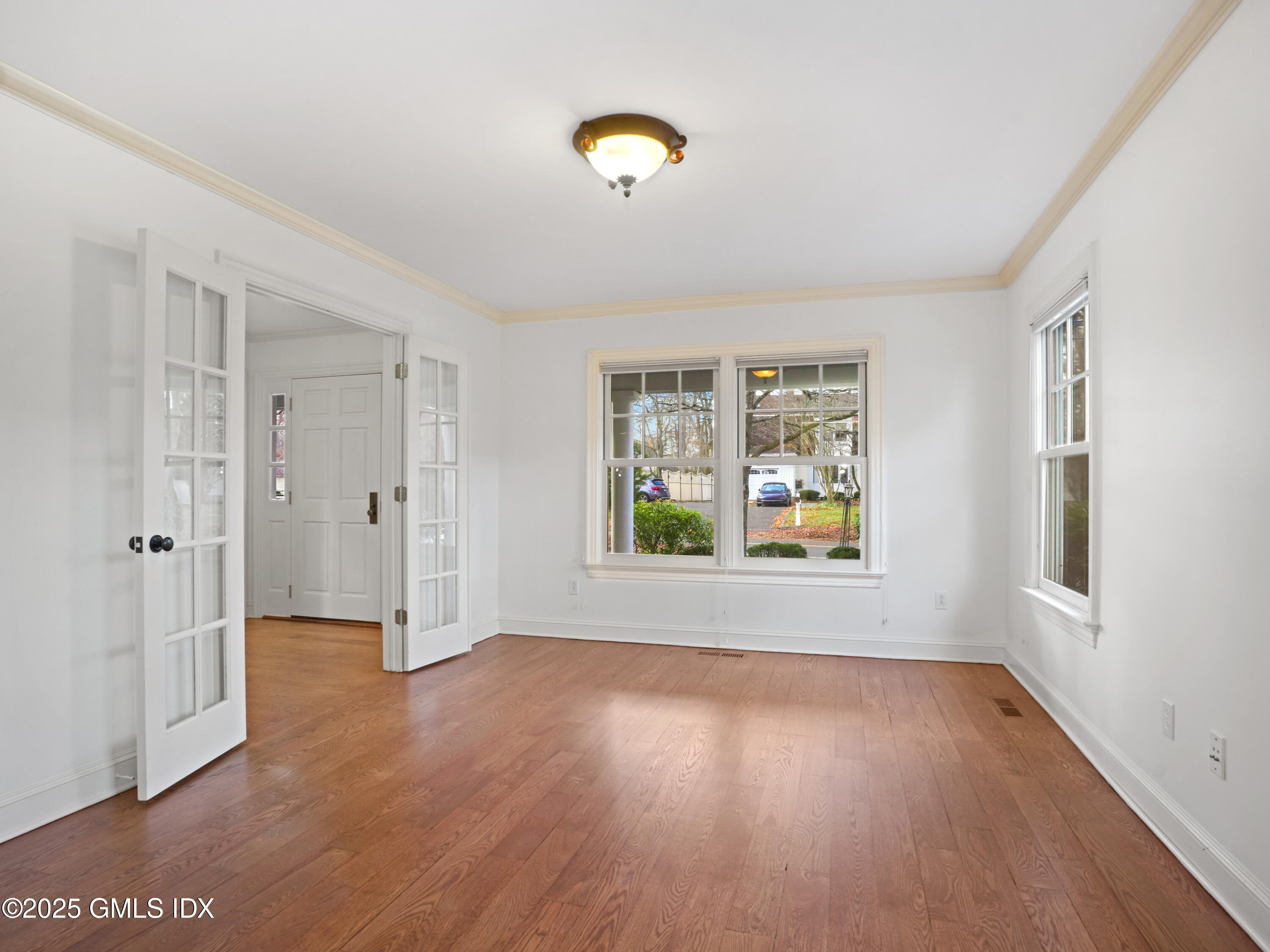 77 Sheep Hill Road Riverside, CT 06878 - Photo 9 of 34 a view of an empty room with wooden floor and a window