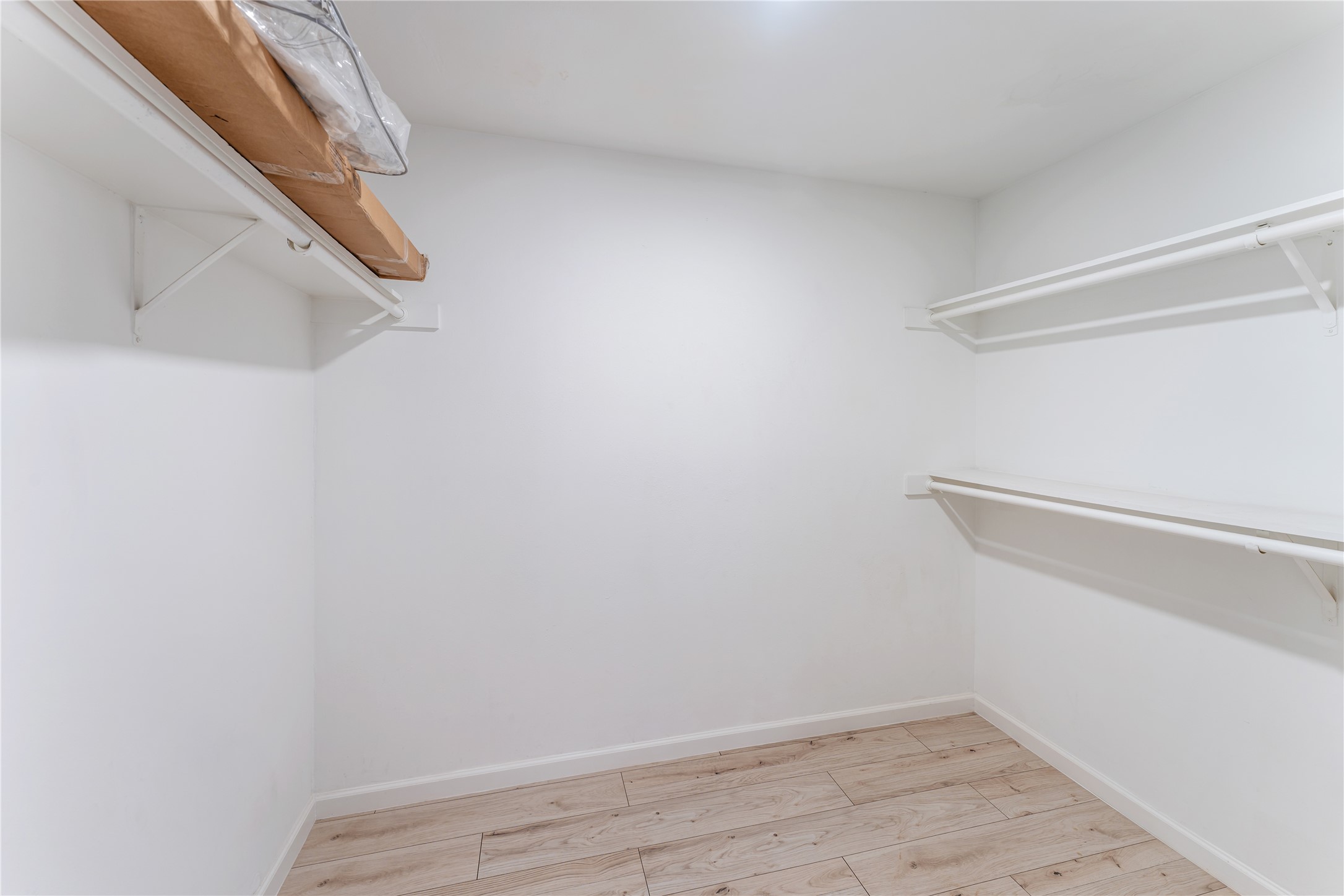 9425 Fondren Road Houston, TX 77074 - Photo 23 of 29 The spacious walk-in closet in the main bedroom is equipped with multiple shelves for ample storage.