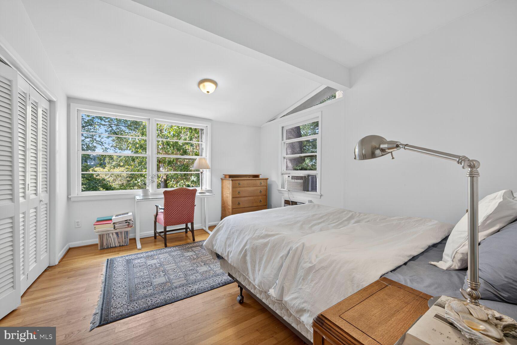 6506 Ridge Drive Bethesda, MD 20816 - Photo 13 of 29 a bedroom with a bed wooden floor and a large window